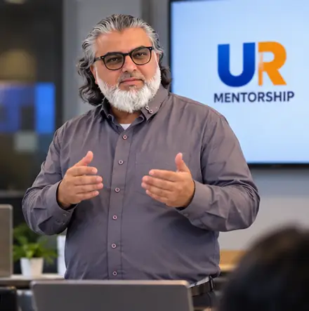 Concept image: portrait of Sheikh Rashid Elahi, founder of UR Print Hub, speaking to a group in a training room